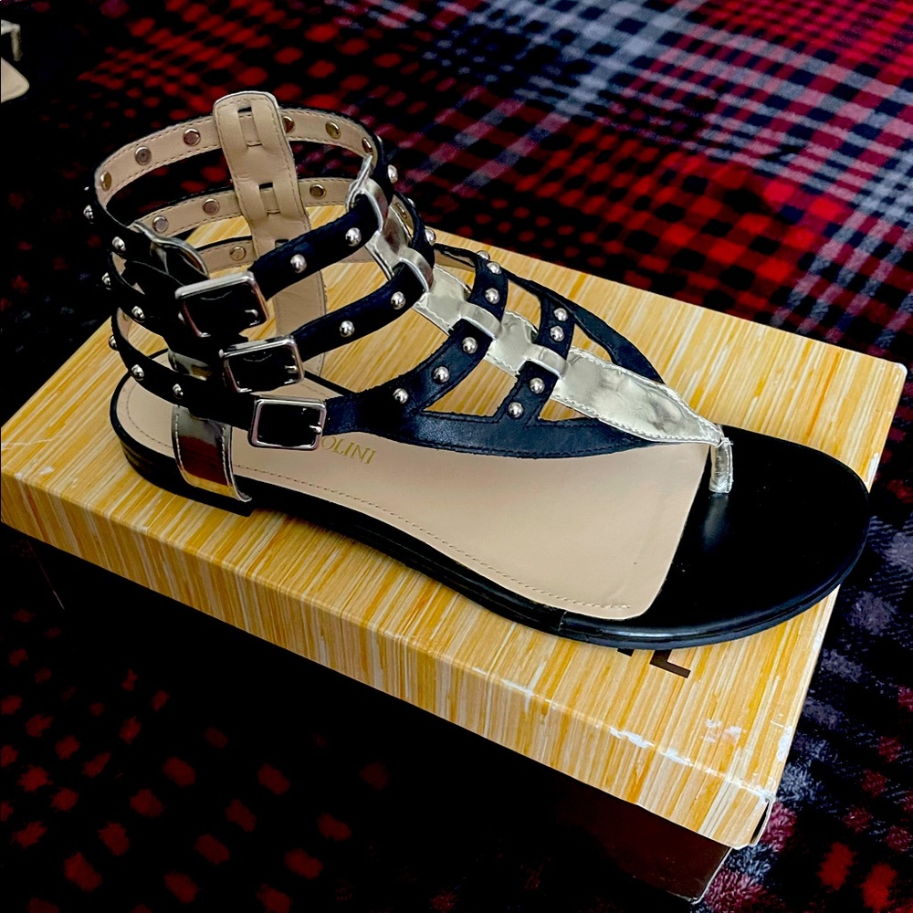 Black sandals with gold details